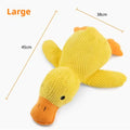 Dog sleeping with a dog hug duck toys to relieve boredom of little